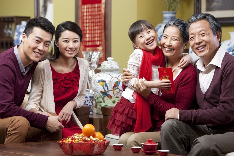 Families come together, gathering around whenever Tet arrives and spring returns.
