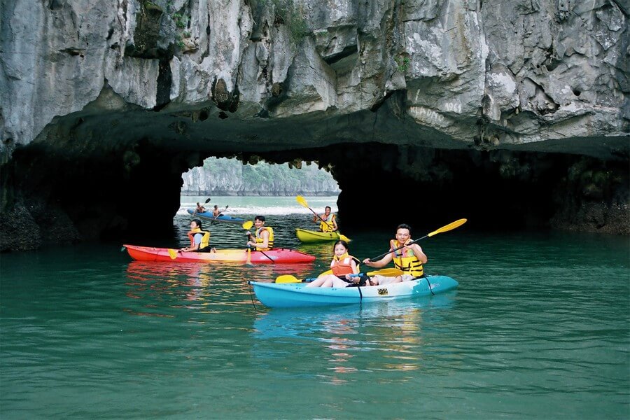 Kayaking to explore the limestone landscape.